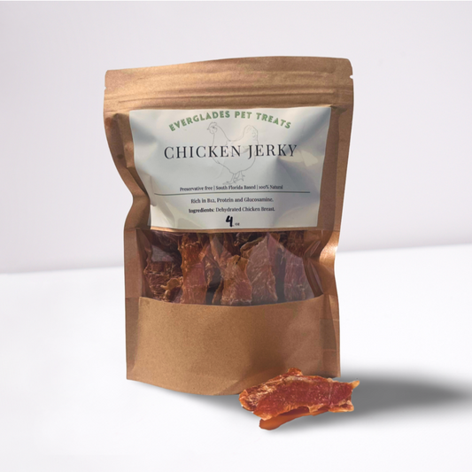 a 4 ounce paper bag containing dehydrated chicken jerky surrounded by chicken jerky with a white blank background.